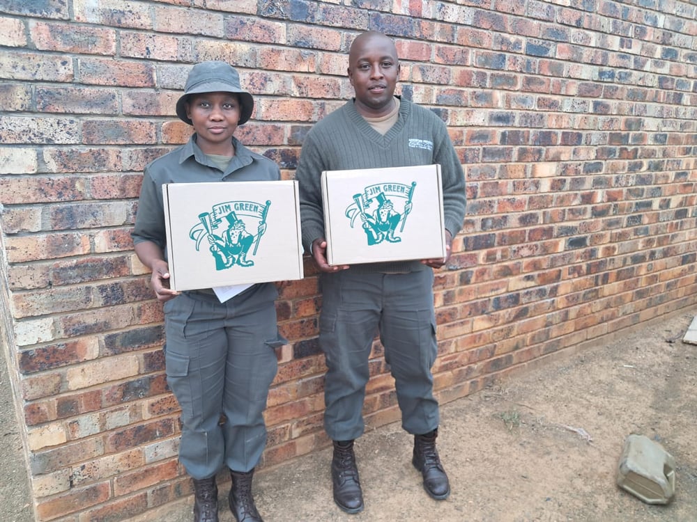 Two rangers proudly holding their new Jim Green boots
